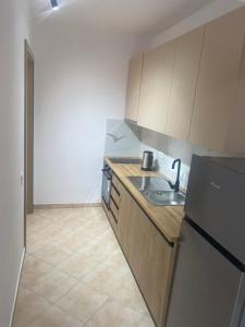 Кухня или мини-кухня в Duplex Durres
 +3 фотографии