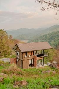a house on a hill with a view at Casa Del Sol - Luxury Villa in Bolepe