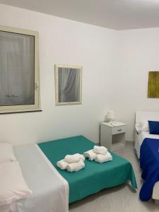 Letto o letti in una camera di Mia House - Appartamento Marzamemi