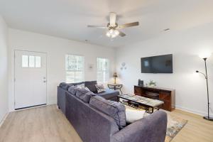 a living room with a couch and a ceiling fan at Pebble Point Cove in Salisbury