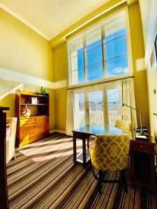 a dining room with a table and a window at Inn By the Sea in Cape Elizabeth