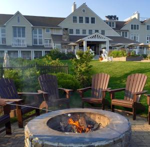 a fire pit in the backyard of a house at Inn By the Sea in Cape Elizabeth