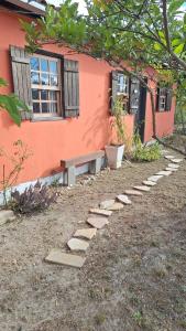 a house with a row of stepping stones next to a building at Casa Donjá in São Gonçalo do Rio das Pedras