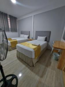 Postel nebo postele na pokoji v ubytování Bendezu Hotel
