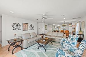 a living room with a couch and a table at Bliss by the Bay in Panama City