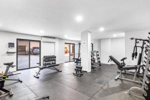 a gym with several treadmills and tread machines at Paulette 901 Loft at Morgan Residences in Cabo San Lucas