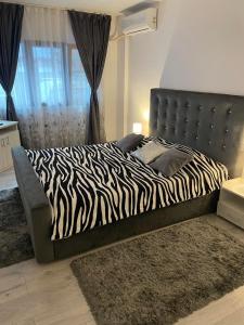 Ένα ή περισσότερα κρεβάτια σε δωμάτιο στο Apartament NECTARIA