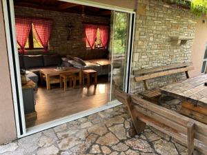 an outdoor patio with a couch and a table at Kamena Kuća in Čapljina