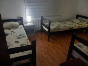 Katil atau katil-katil dalam bilik di Apartmani Ćosić