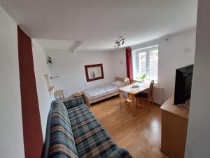 a living room with a couch and a table at Ferienhaus Schrems in Schrems