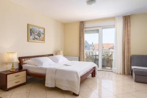 Posteľ alebo postele v izbe v ubytovaní Apartments Jozic