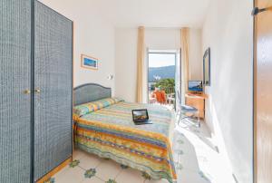 Postel nebo postele na pokoji v ubytování Hotel Citara