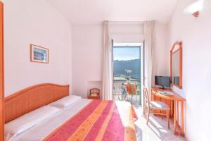 Postel nebo postele na pokoji v ubytování Hotel Citara + 37 fotografií