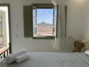 Ένα ή περισσότερα κρεβάτια σε δωμάτιο στο Siroco Deluxe House