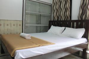Krevet ili kreveti u jedinici u objektu Madhur Villa Guest House