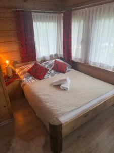 Postel nebo postele na pokoji v ubytování U Młynorza