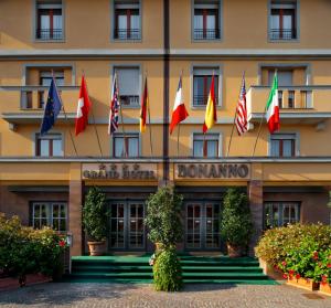 a hotel with flags on the front of it at Grand Hotel Bonanno in Pisa