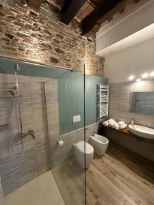 a bathroom with a glass shower and a sink at Ca'Silvia in San Savino +59 photos