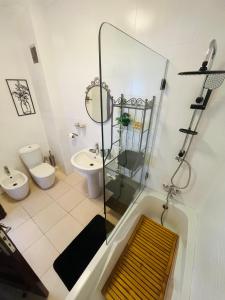 a bathroom with a shower and a toilet and a sink at Bright Apartment with Sea View, few steps away from the TGV in Tangier +19 photos