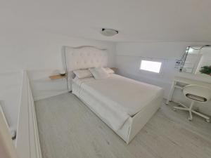 Ένα ή περισσότερα κρεβάτια σε δωμάτιο στο Tenerife Little Village Duplex