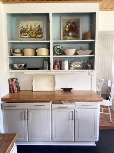 a kitchen hutch with a wooden counter top at Farm Stay B & B in Annerstad
