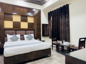Postel nebo postele na pokoji v ubytování Hotel Radiance