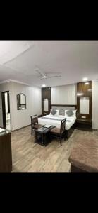Postel nebo postele na pokoji v ubytování Hotel Radiance
