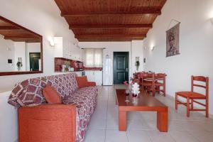 a living room with a couch and a table at Etherial Stay in Corfu island Home166 in Glyfada