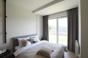 Postel nebo postele na pokoji v ubytování Panorama - Magiczny Horyzont