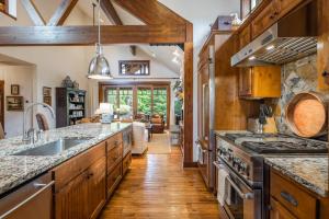 a kitchen with a sink and a stove at Suncadia 3 Bdrm Pet Friendly Home with Hot Tub in Cle Elum