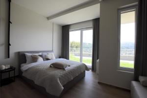 Postel nebo postele na pokoji v ubytování Panorama - Magiczny Horyzont