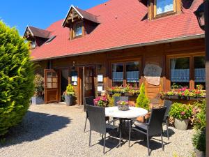 a patio with a table and chairs in front of a house at Haus Marksburg in Lahnstein
