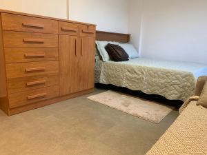 Ένα ή περισσότερα κρεβάτια σε δωμάτιο στο Flat aconchegante à 5min do Centro de São lourenço