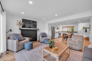 a living room filled with furniture and a fireplace at Modern 3BR in Serene Area Near Ski Slopes and Town in Park City