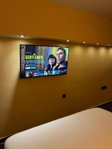 a flat screen tv hanging on a wall at evexia apartment in Kavala