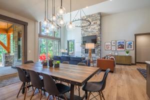 a dining room and living room with a table and chairs at Suncadia 5 Bdrm Pet Friendly Home Overlooking Prospector in Cle Elum