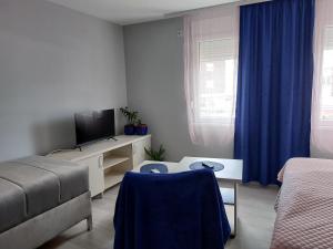 Postel nebo postele na pokoji v ubytování Apartments MIMOZA