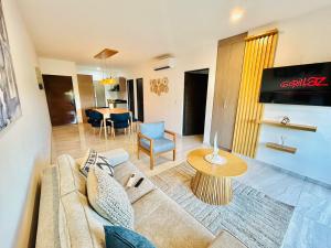 a living room with a couch and a table at moderno con alberca cerca de la playa by G P S rentas in Mazatlán