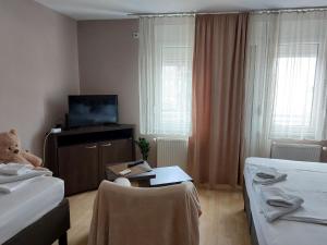 Postel nebo postele na pokoji v ubytování Apartments MIMOZA