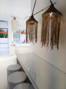 a kitchen with a table and two stools at Meteora Superior Collection Villas III in Kalabaka