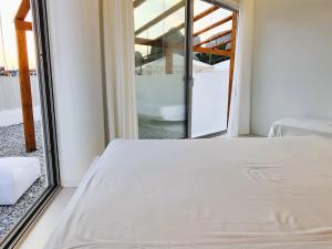 a bedroom with a bed and a large mirror at Meteora Superior Collection Villas III in Kalabaka