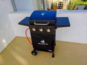 a grill with a blue top on a table at Riva in Klenovica +129 photos