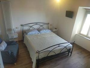 A bed or beds in a room at Agriturismo Il Bel Vedere