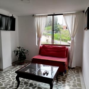 TV a/nebo společenská místnost v ubytování Bonito apartamento con excelente ubicación