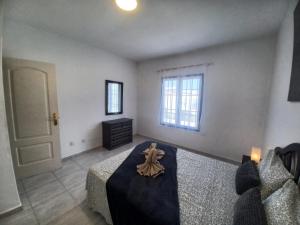 A bed or beds in a room at Relax playa blanca