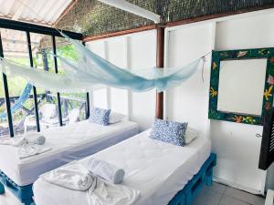 Postel nebo postele na pokoji v ubytování El Hamaquero Hostal EcoNativo
