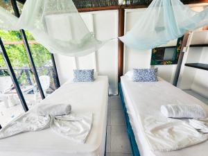 Postel nebo postele na pokoji v ubytování El Hamaquero Hostal EcoNativo