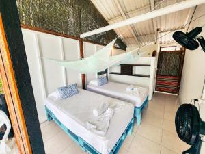 Postel nebo postele na pokoji v ubytování El Hamaquero Hostal EcoNativo