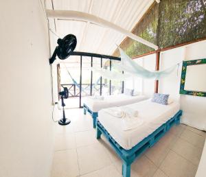 Postel nebo postele na pokoji v ubytování El Hamaquero Hostal EcoNativo