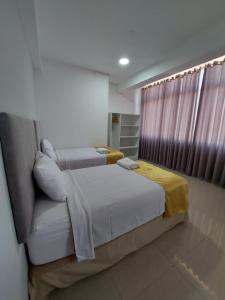 Postel nebo postele na pokoji v ubytování Bendezu Hotel